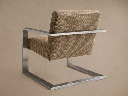 Sabina Chair with a steel frame, woven fabric upholstery in beige tones, showcasing a modern, minimalistic design against a plain background.
