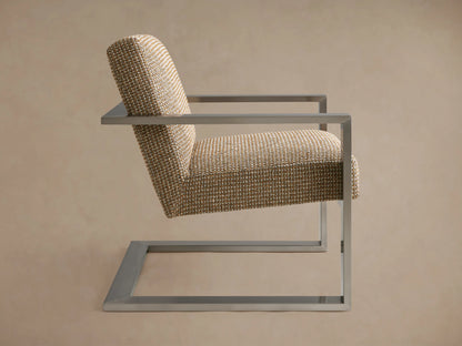 A contemporary Sabina Chair with a modern design, featuring a woven fabric seat and backrest supported by a sleek, metallic frame.