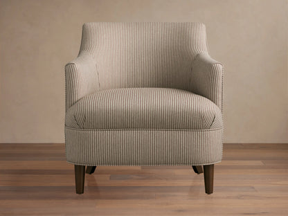Savannah Chair: greige fabric armchair with thin dark vertical stripes, dark tapered legs, angled on a wooden floor.
