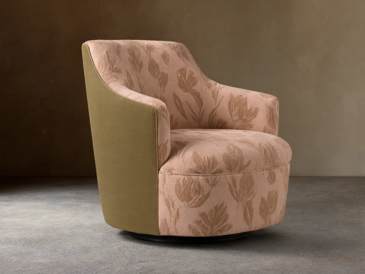 Savannah Swivel Chair in beige fabric with tan floral pattern, angled on wooden floor against neutral wall.