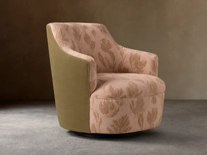 Savannah Swivel Chair in beige fabric with tan floral pattern, angled on wooden floor against neutral wall.