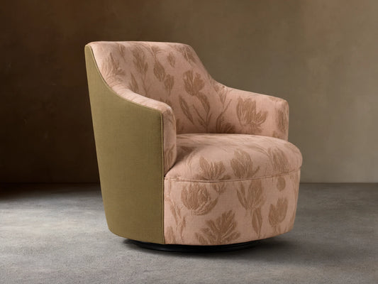 Savannah Swivel Chair in beige fabric with tan floral pattern, angled on wooden floor against neutral wall.