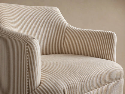 Savannah Swivel Chair, upholstered in light beige fabric with thin vertical taupe stripes, on a wooden floor.