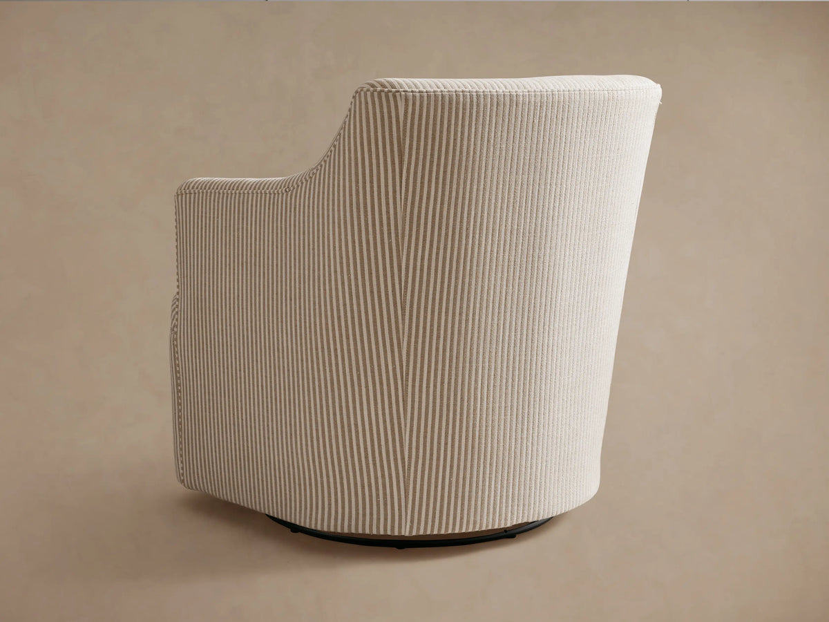 Close-up of Savannah Swivel Chair, upholstered in light beige and tan striped fabric, showing back, arm, and seat.