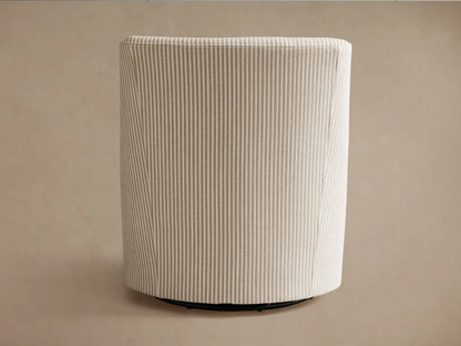 Savannah Swivel Chair, seen from back-left. Light beige fabric with vertical grey pinstripes and dark swivel base.