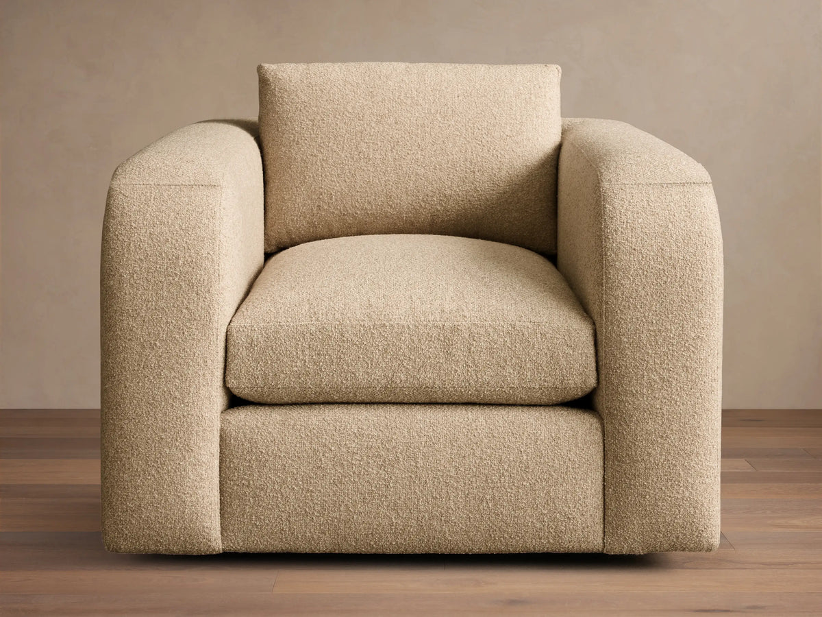 Front view of the beige textured Stiles Chair with wide arms and a square back cushion.