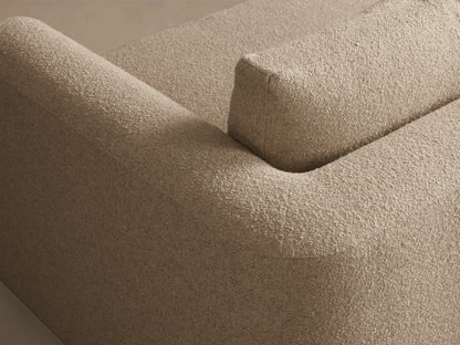 Close-up of the corner of a beige Stiles Sofa, highlighting its textured woven fabric on the armrest and backrest.