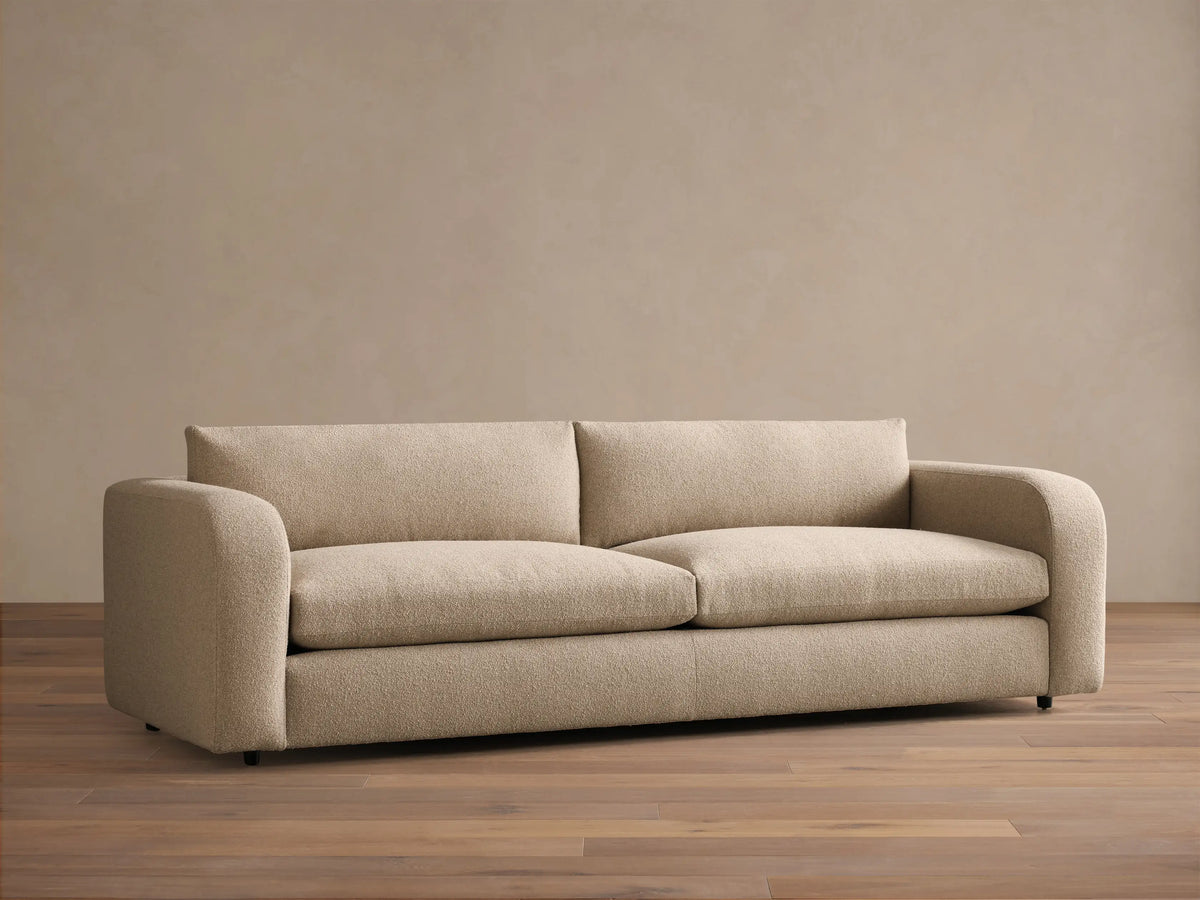 Front view of the beige Stiles Sofa featuring two seat cushions, two back cushions, and rounded arms.