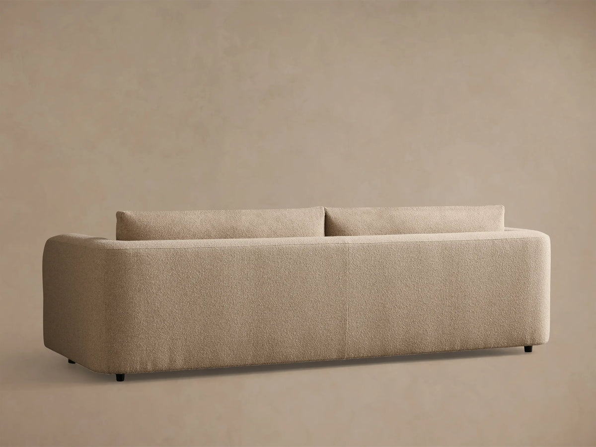Front view of a light beige textured Stiles Sofa, featuring rounded arms, two seat cushions, and two back cushions.