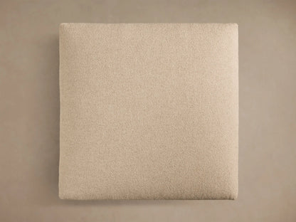 Top view of the square cream Stiles Ottoman. It features a textured fabric upholstery and soft, slightly rounded edges.