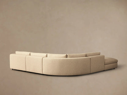Close-up of the light beige textured fabric on the arm and backrest of the Stiles Five-Piece Sectional.