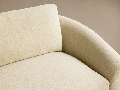 Avon Sofa, light cream textured fabric, two seat and back cushions, low curved arms, dark legs, on wood floor.