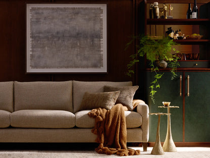Front view of the light beige Kipton Slim Arm Elevated Three-Cushion Sofa with slim arms and dark wood feet.