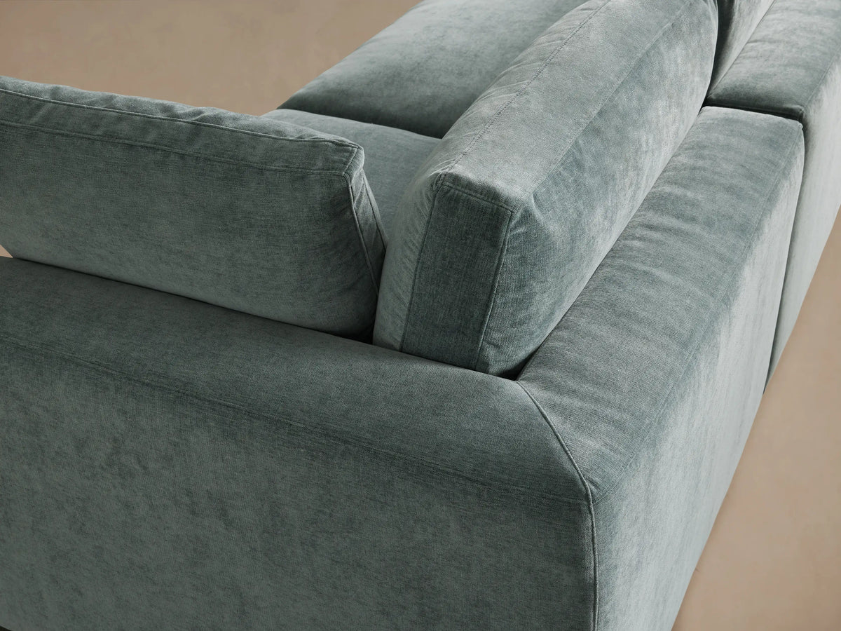 Beale Three-Piece Modular Sofa in plush, dusty teal fabric. Three seat cushions, three back cushions, and two arm pillows.