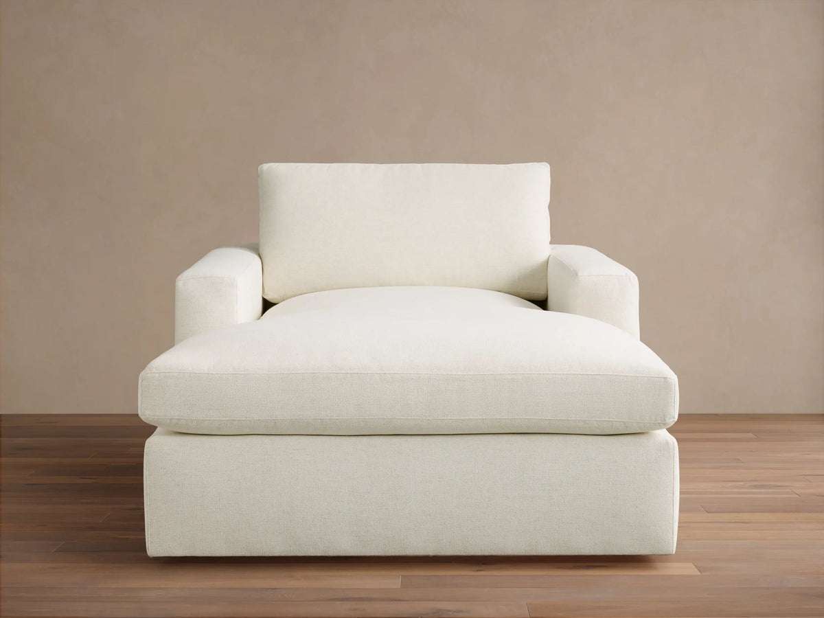 Front view of Cream Plush Chaise Lounge, featuring deep cushions and wide square arms.
