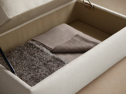 Close-up of the cream woven upholstery fabric on a cushion, showing a clean seam line.