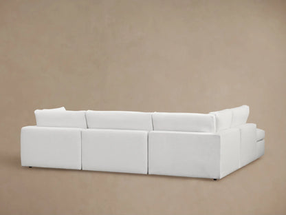 Beale Two-Piece Bumper Sectional shown in a light fabric with plush seat and back cushions, featuring a smooth, contemporary design and subtle fabric texture.