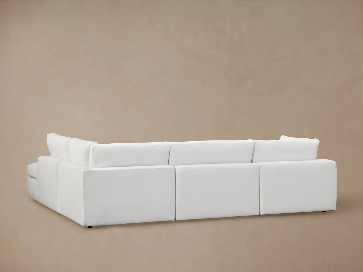 Beale Two-Piece Bumper Sectional in light fabric, featuring a plush cushion and wide backrest, showcasing casual elegance.