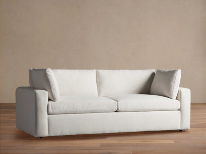 Front view of an oatmeal Beale Sofa, featuring two seat cushions, two back cushions, and two armrest pillows.
