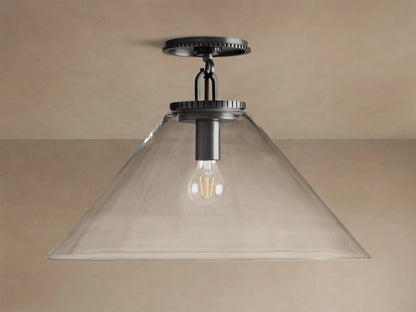 Wescott Cone Flush Mount with dark bronze hardware, clear glass cone shade, and visible Edison bulb, on a tan ceiling.