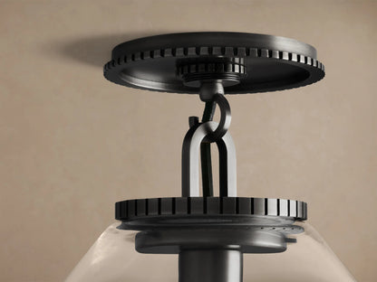 Wescott Cone Flush Mount: dark metal fixture with ridged canopy, clear glass cone shade, and visible filament bulb.