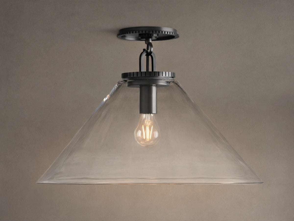 Wescott Cone Flush Mount with dark bronze hardware, clear glass cone shade, and visible Edison bulb, on a tan ceiling.